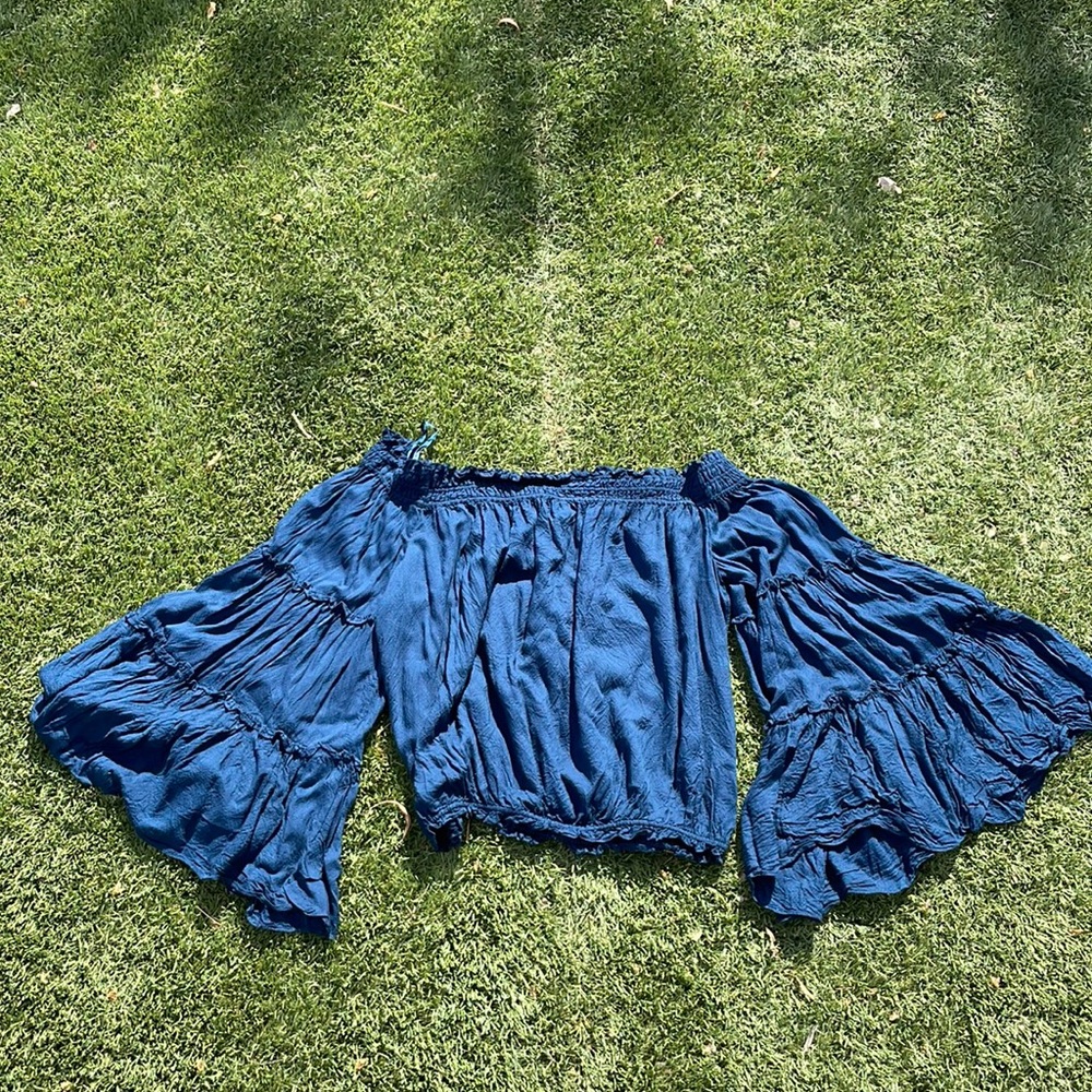 Free people off the shoulder shirt. Size medium.